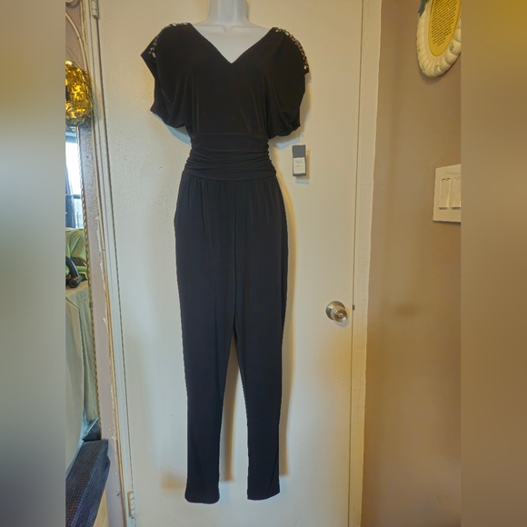 Guess Pants - New..Guess jumpsuit, size small..black color..for small waist girls.